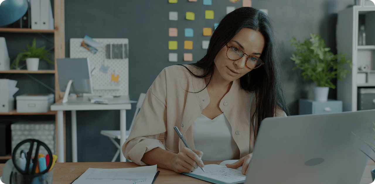 Candidate preparing CV with laptop